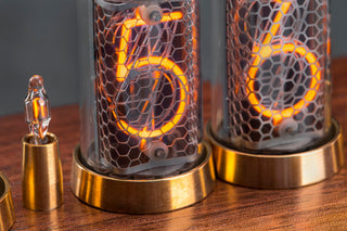 Two IN-8-2 Nixie tubes lit, showing a real 5 and a 6 — fitted in our six-tube clock