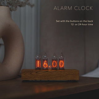 IN-14 Nixie tube clock as an alarm clock on a bedside table