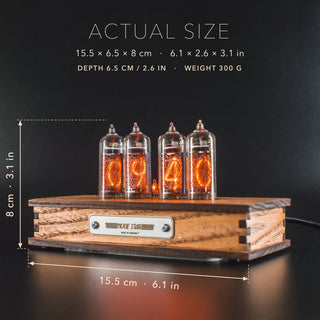 Nixie tube clock IN-14 with its size marked: 15.5 cm (6.1 in) long, 6.5 cm (2.6 in) deep, 8 cm (3.1 in) high, weight 300 g