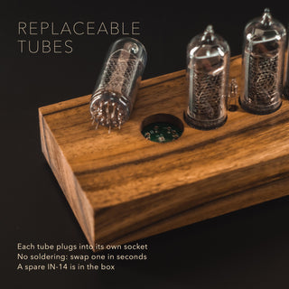 Replaceable IN-14 Nixie tube lifted out of its socket in the solid walnut block case with square corners, no soldering needed