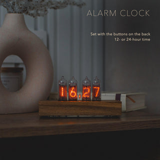 IN-14 Nixie tube clock as an alarm clock on a bedside table