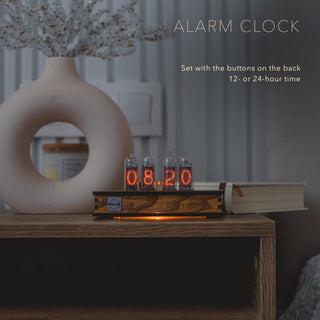 IN-14 Nixie tube clock as an alarm clock on a bedside table