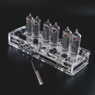 Six-tube IN-14 Nixie clock from above with tubes off, board inside the clear acrylic